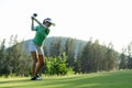 Golfer sport approach on course golf ball fairway.ÃÂ  People lifestyle woman playing game golf tee off Royalty Free Stock Photo
